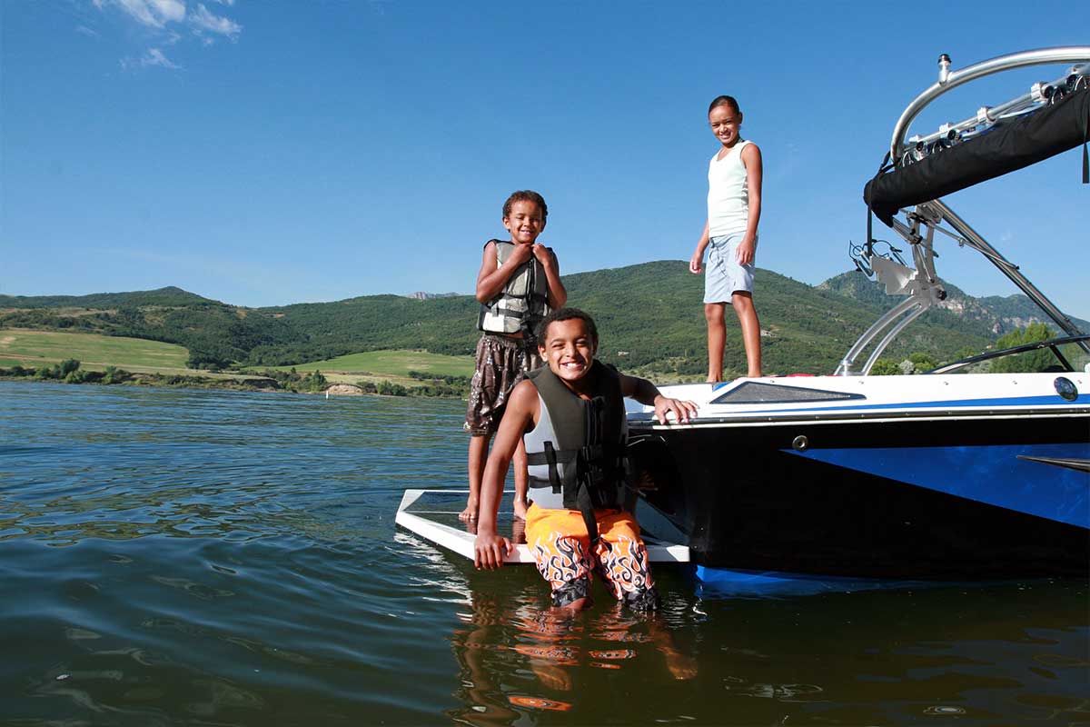 Kids swimming boat